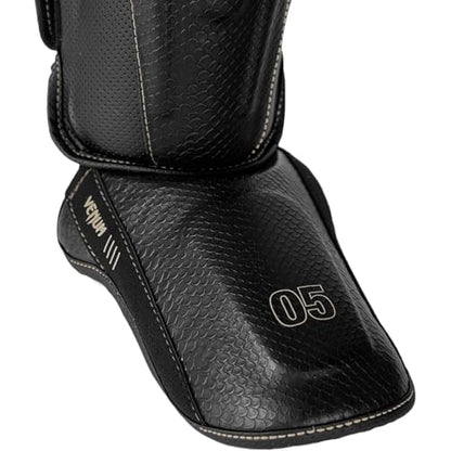 Venum Impact Evo Scales Shin Guards - color: Black